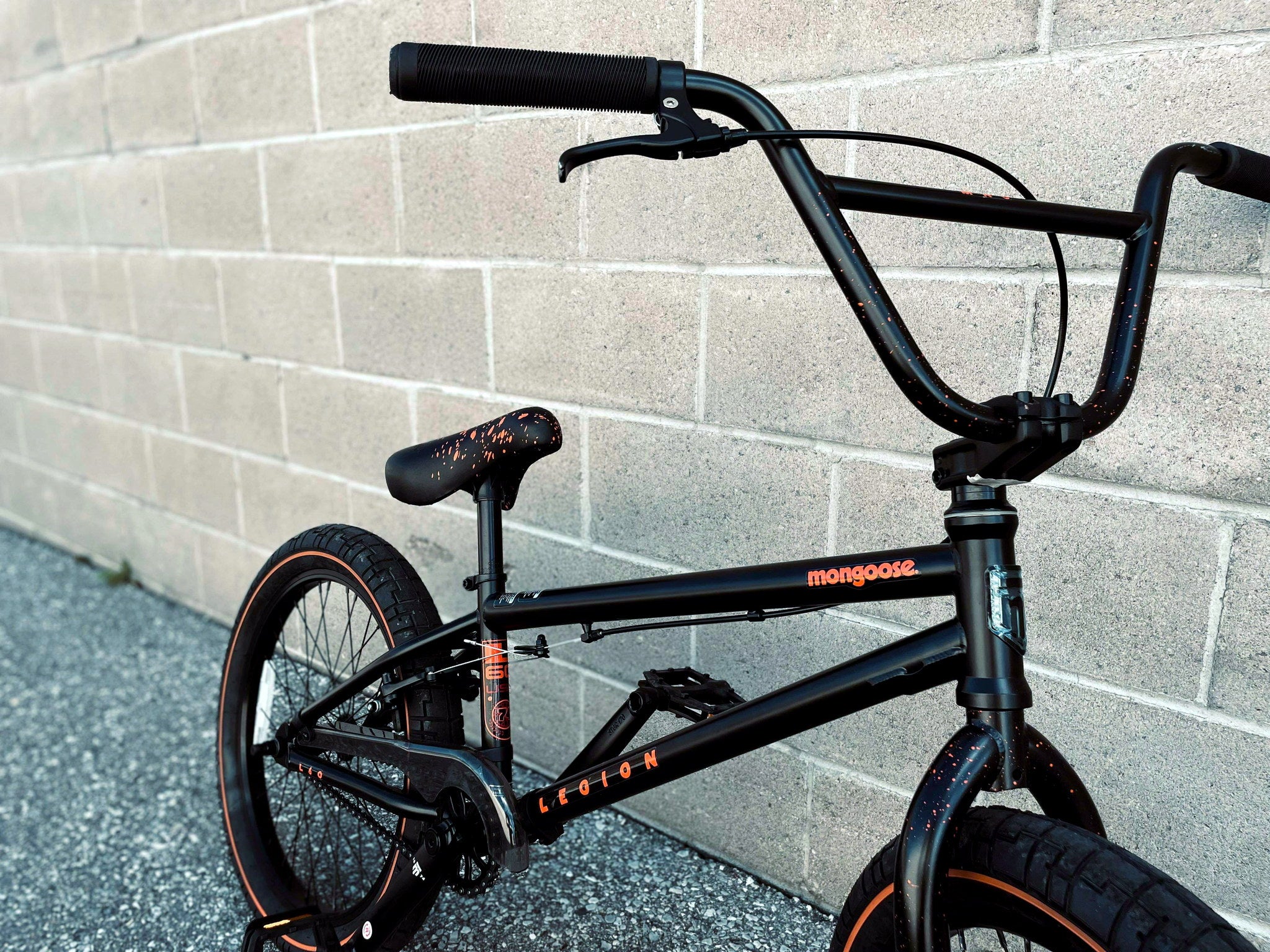Close-up of the Mongoose Legion L60 BMX bike handlebar and frame, showcasing the freestyle 20-inch BMX design and build details.