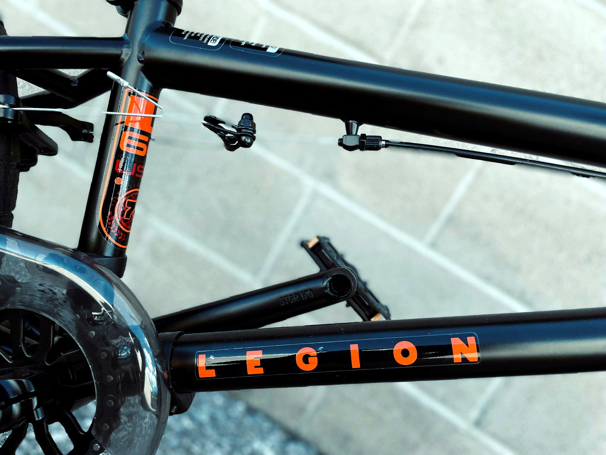 Close-up of Mongoose Legion L60 BMX bike frame with logo and detailed craftsmanship, showcasing the freestyle 20-inch BMX design.