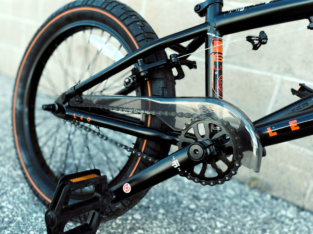 Close-up of Mongoose Legion L60 BMX bike drivetrain, showcasing the freestyle 20-inch BMX bike's gears and chain components.