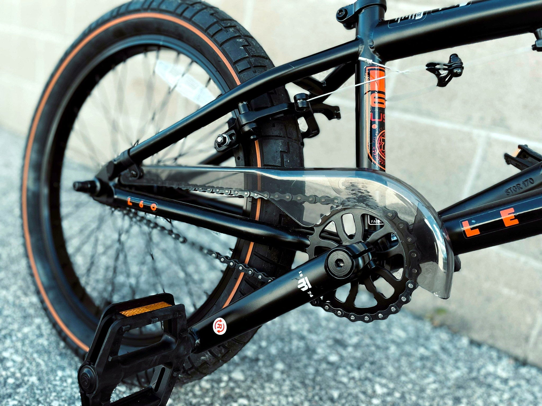Close-up of Mongoose Legion L60 BMX bike drivetrain, showcasing the freestyle 20-inch BMX bike's gears and chain components.