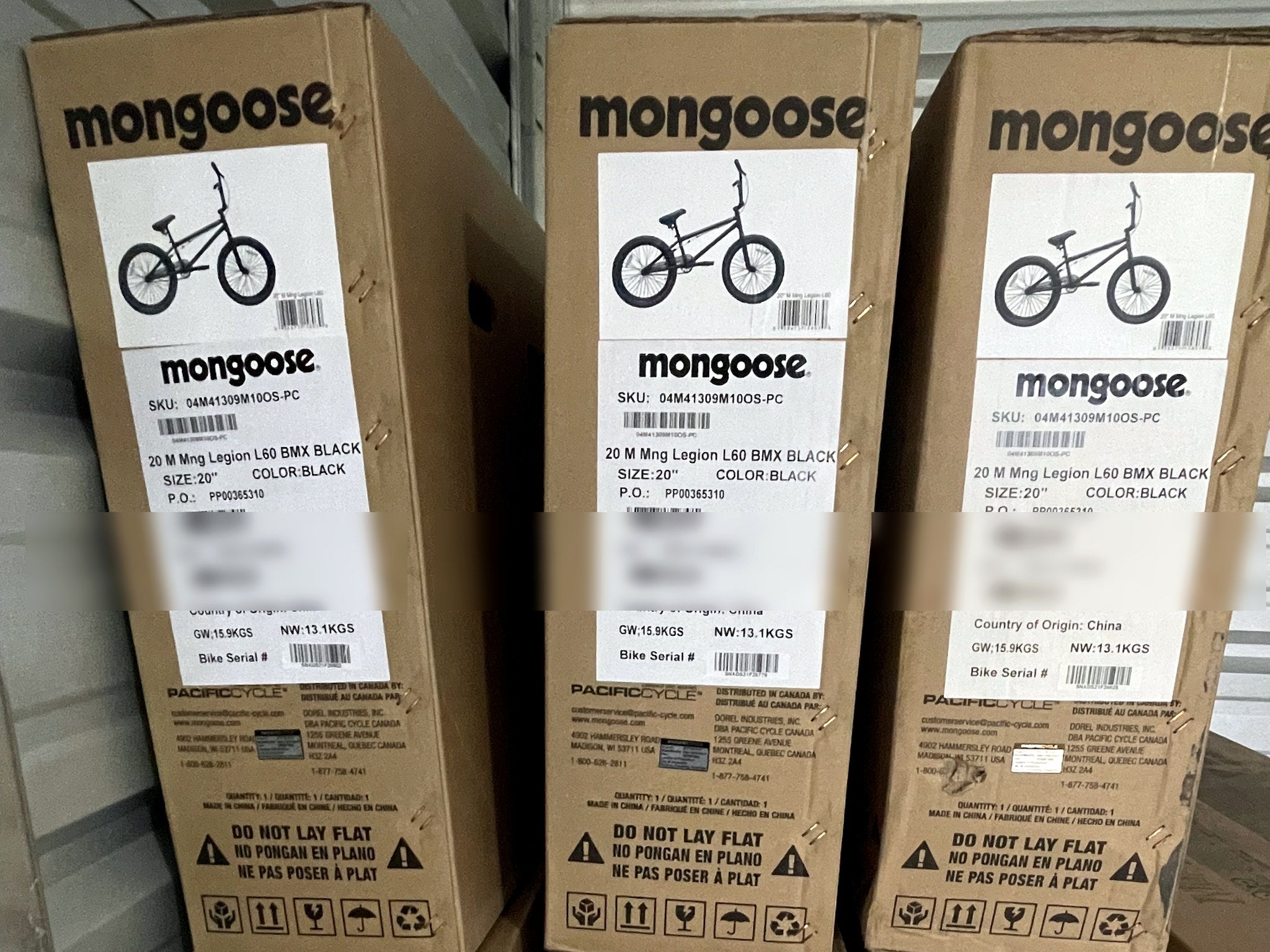 Brand-new Mongoose Legion L60 BMX bike in its box, featuring a 20-inch freestyle BMX design with sturdy frame and vibrant colors.